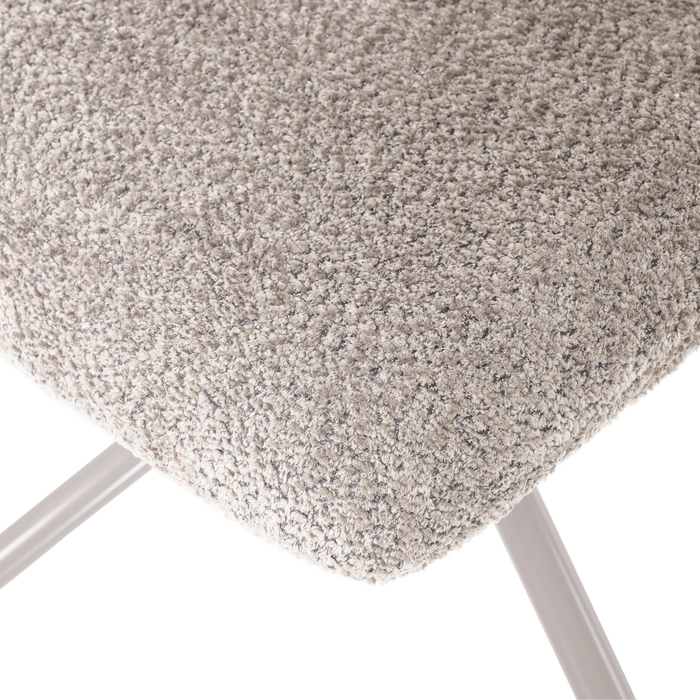 Šviesiai pilko bouclé audinio tekstūros detalė